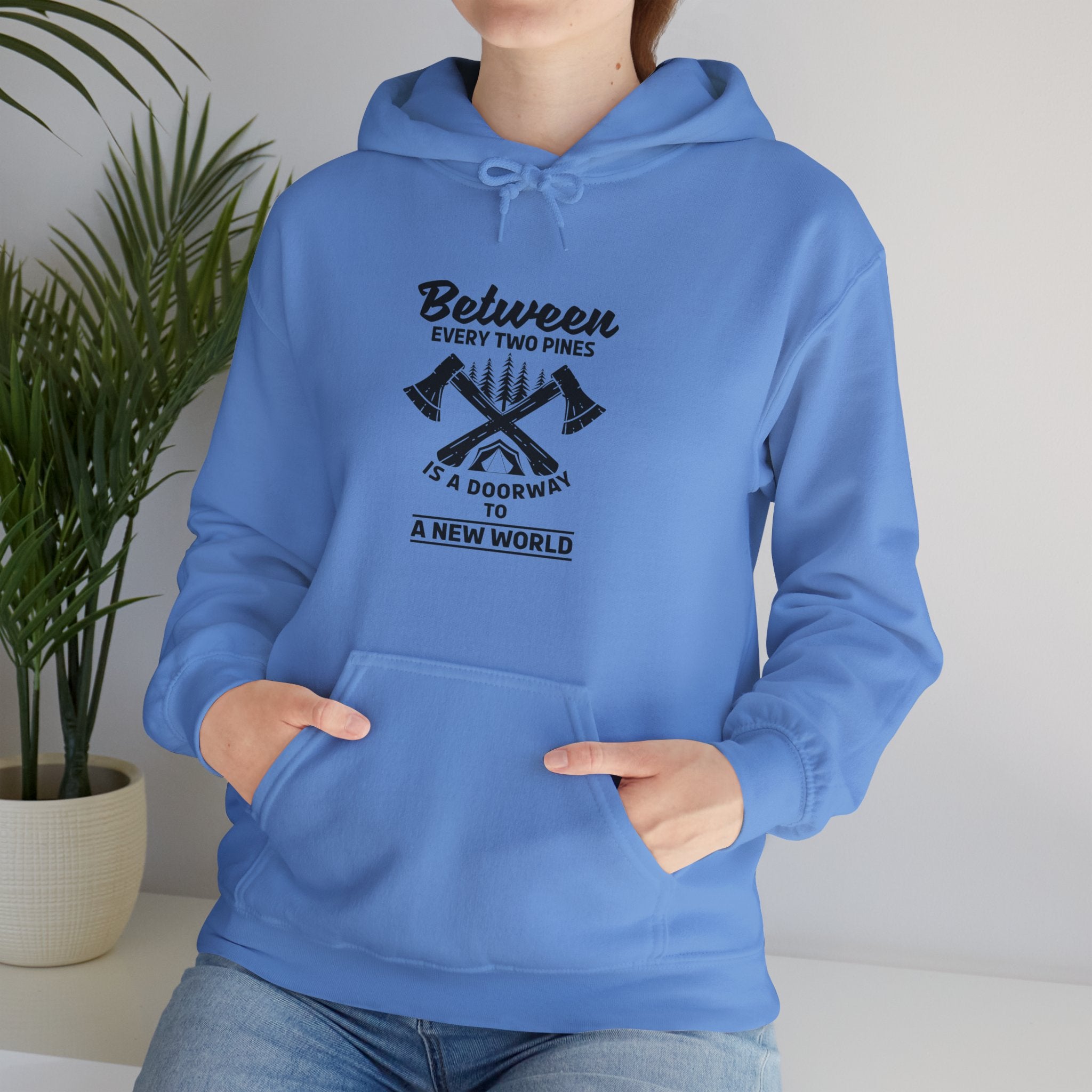 "Between Every Two Pines Is A Door To New World" Unisex Heavy Blend™ Hooded Sweatshirt