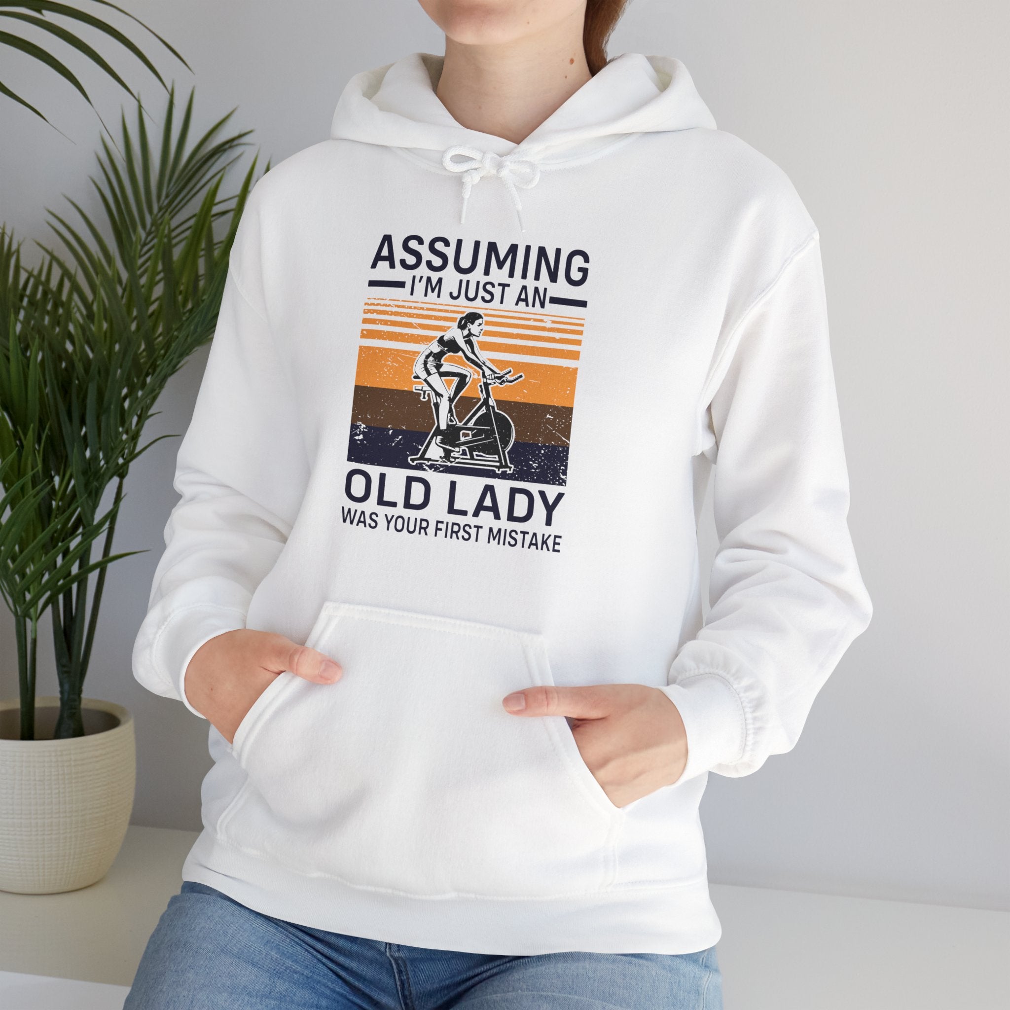 "Assuming I M Just An Old Lady Was Your First Mistake"  Unisex Heavy Blend™ Hooded Sweatshirt