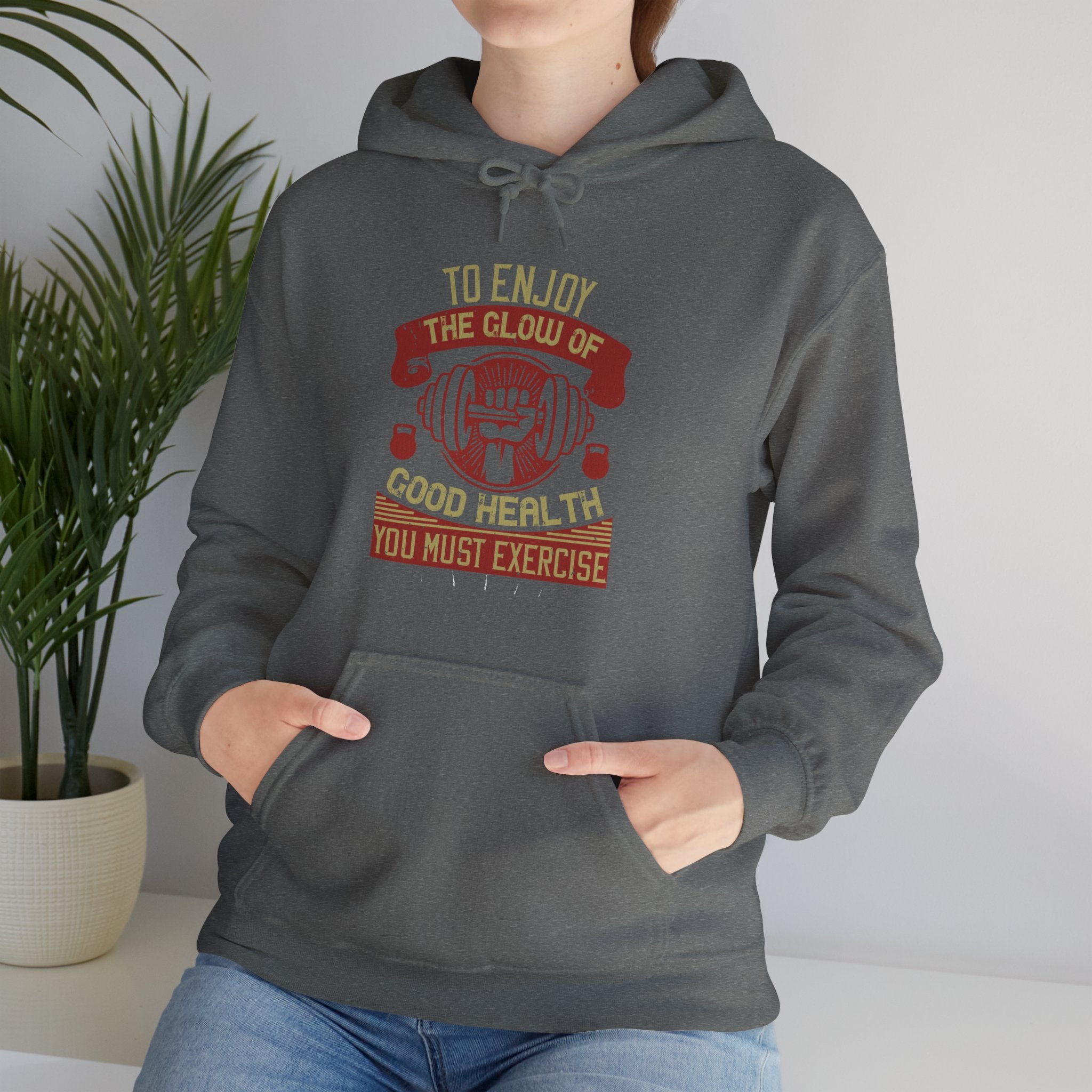 "To enjoy the glow of good health, you must exercise"  Unisex Heavy Blend™ Hooded Sweatshirt