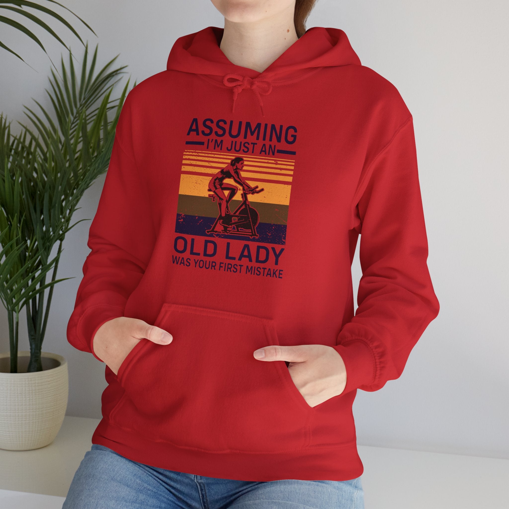 "Assuming I M Just An Old Lady Was Your First Mistake"  Unisex Heavy Blend™ Hooded Sweatshirt