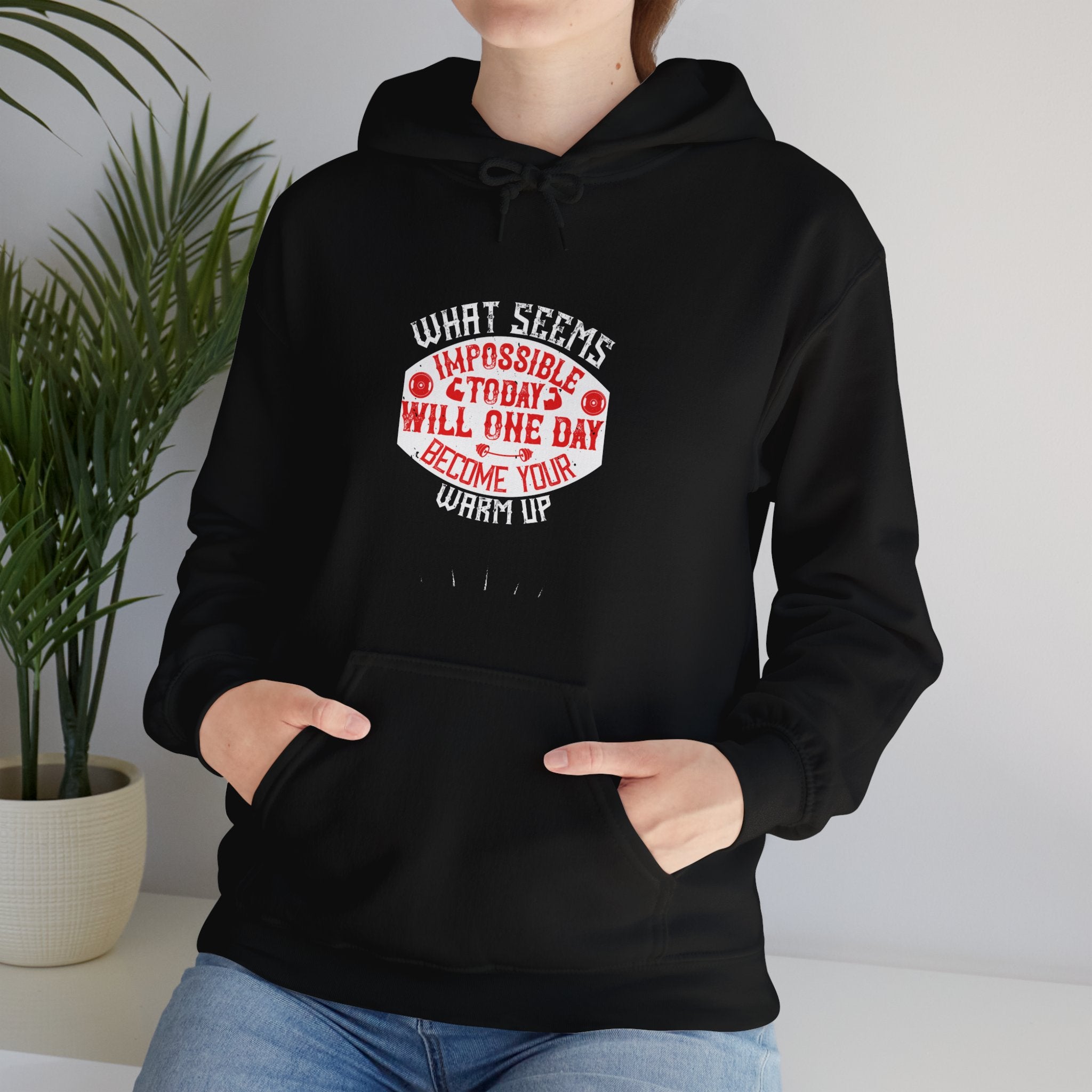 "What seems impossible today will one day become your warm-up" Unisex Heavy Blend™ Hooded Sweatshirt