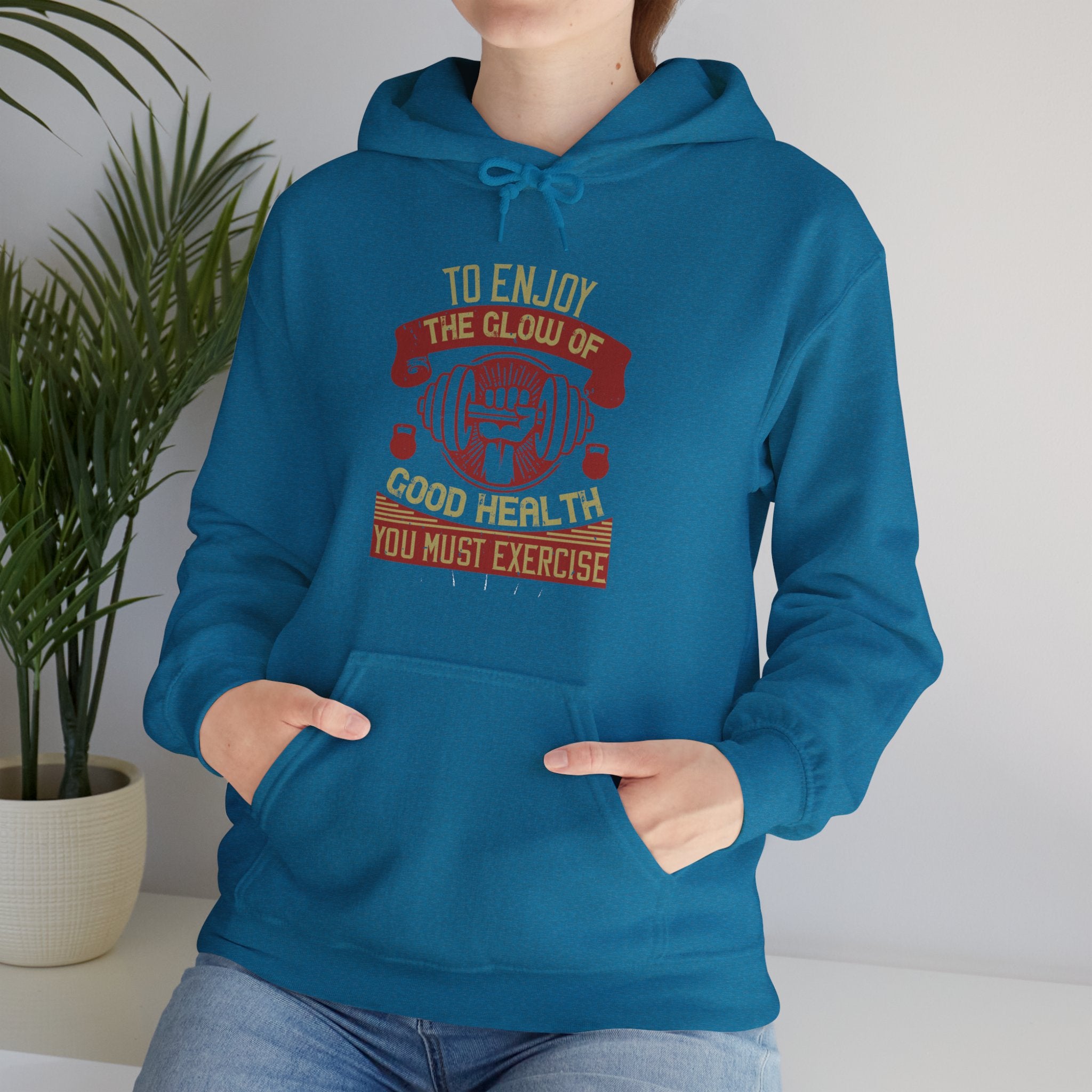 "To enjoy the glow of good health, you must exercise"  Unisex Heavy Blend™ Hooded Sweatshirt