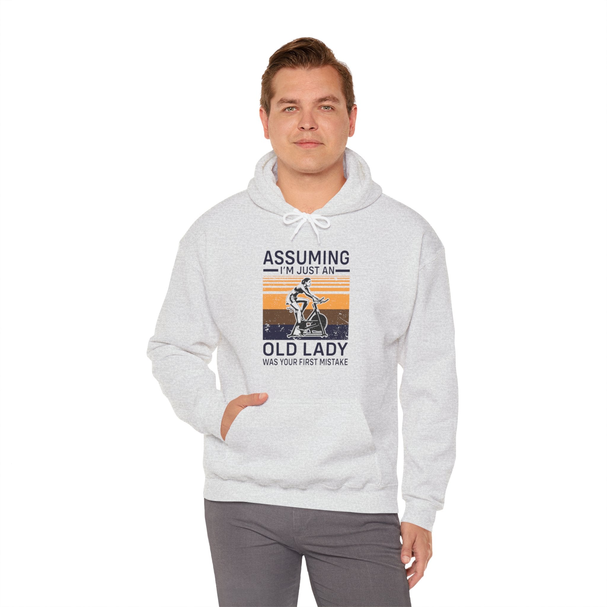 "Assuming I M Just An Old Lady Was Your First Mistake"  Unisex Heavy Blend™ Hooded Sweatshirt