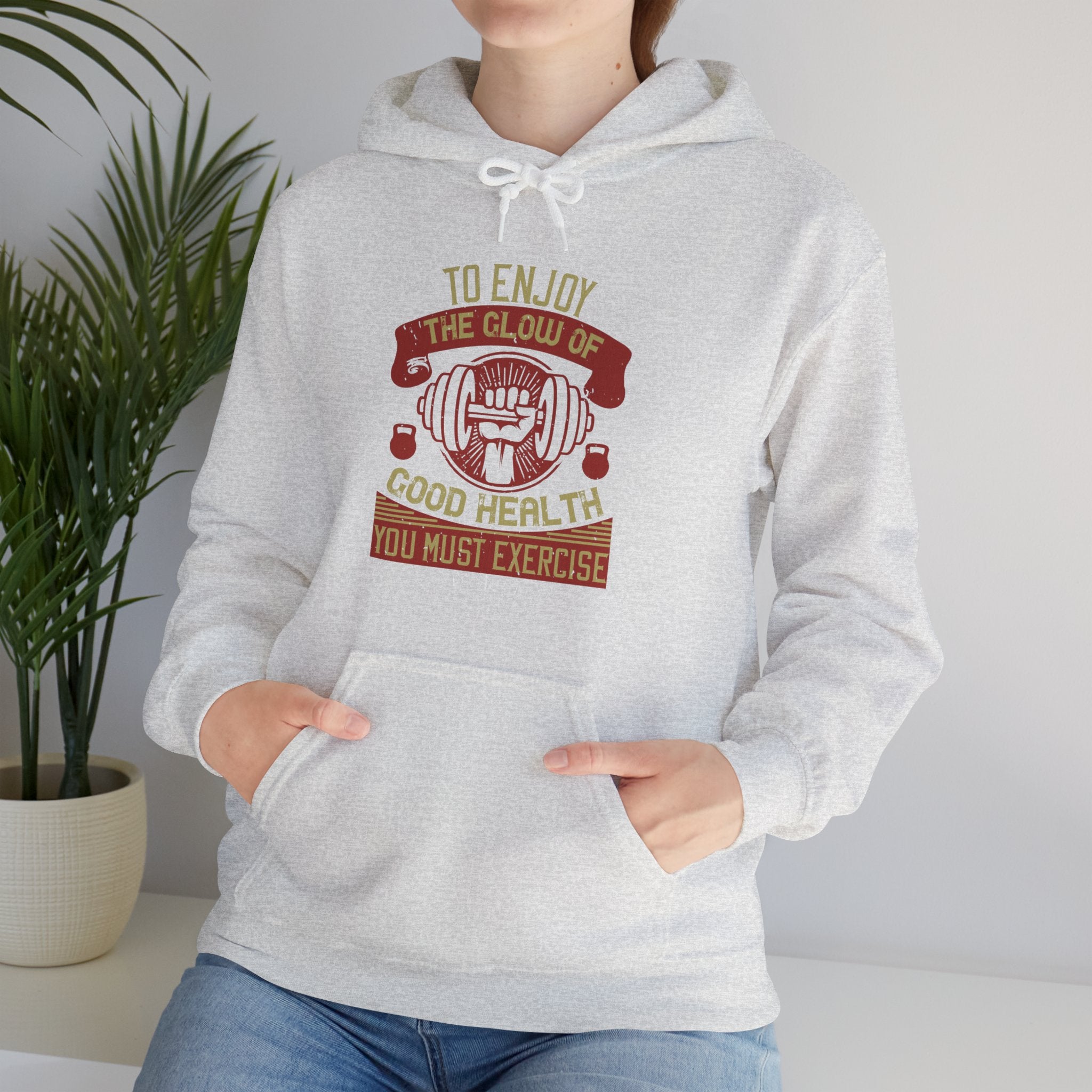 "To enjoy the glow of good health, you must exercise"  Unisex Heavy Blend™ Hooded Sweatshirt