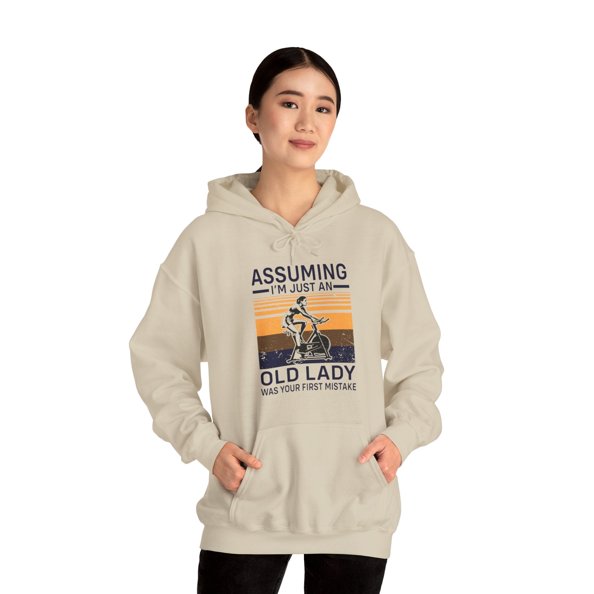 "Assuming I M Just An Old Lady Was Your First Mistake"  Unisex Heavy Blend™ Hooded Sweatshirt