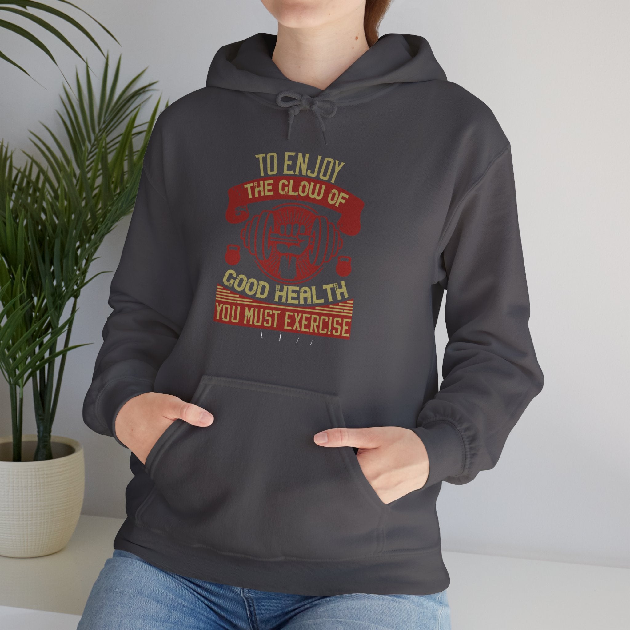 "To enjoy the glow of good health, you must exercise"  Unisex Heavy Blend™ Hooded Sweatshirt