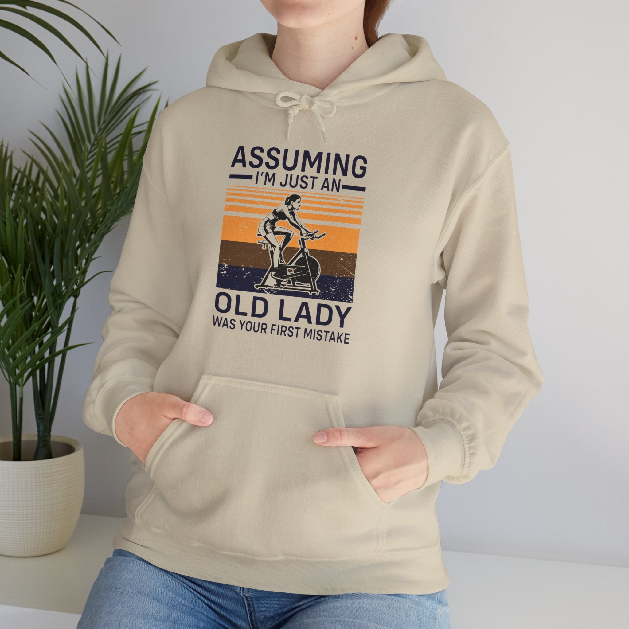 "Assuming I M Just An Old Lady Was Your First Mistake"  Unisex Heavy Blend™ Hooded Sweatshirt