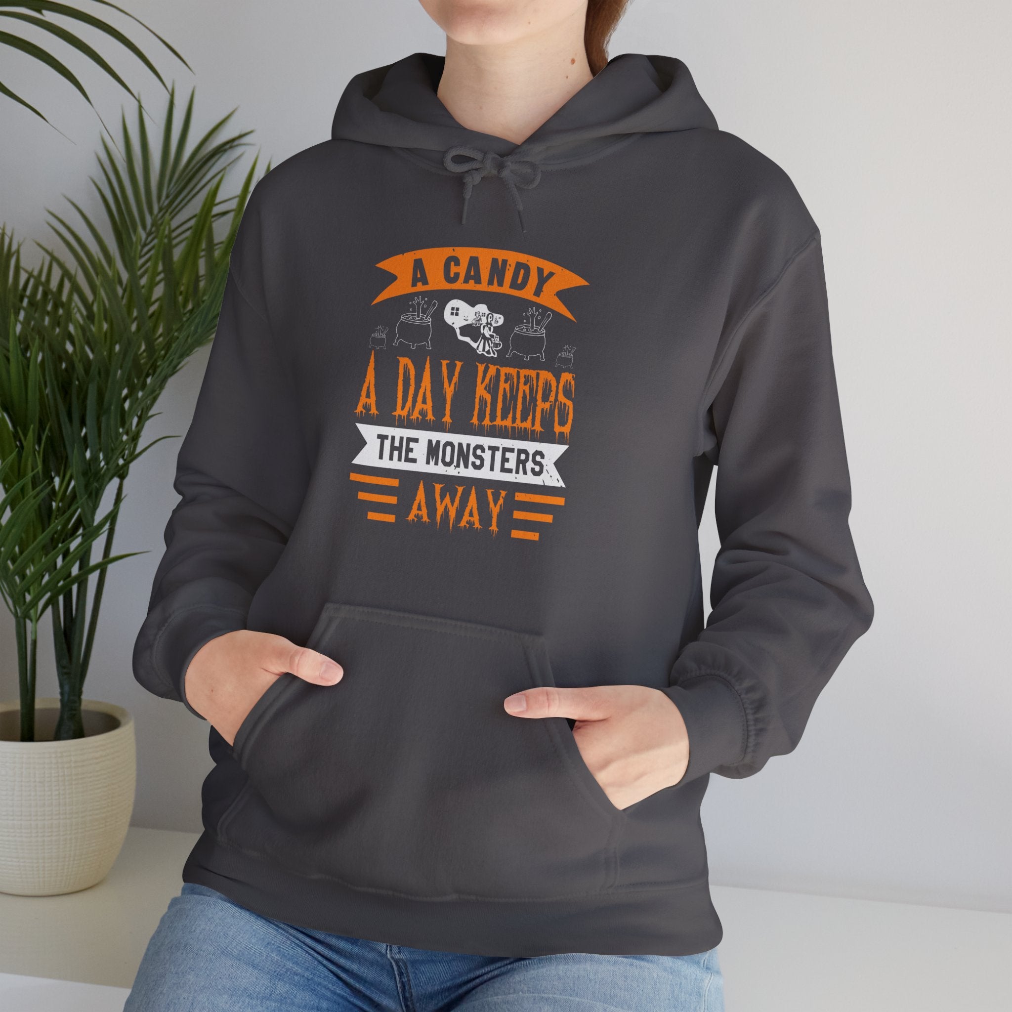 "A CANDY A DAY KEEPS THE MONSTERS AWAY" Unisex Heavy Blend™ Hooded Sweatshirt