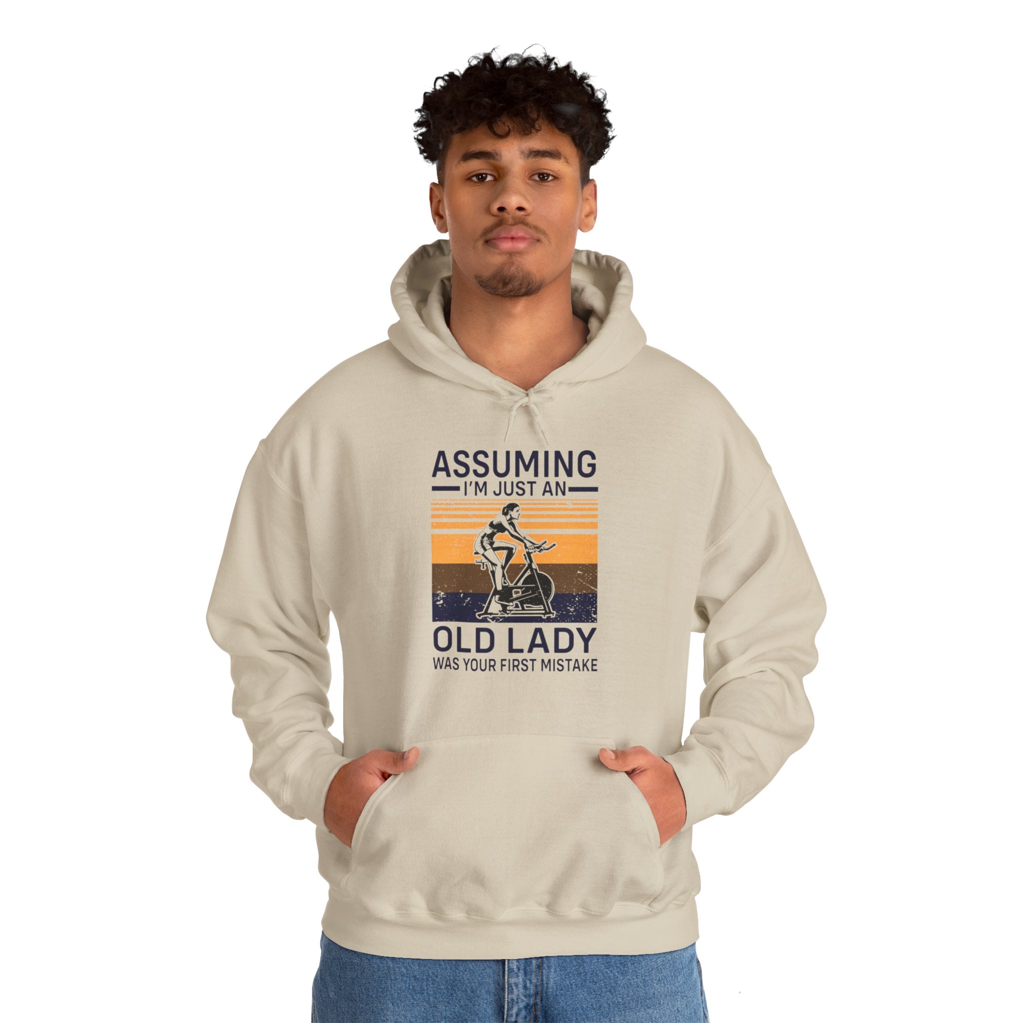 "Assuming I M Just An Old Lady Was Your First Mistake"  Unisex Heavy Blend™ Hooded Sweatshirt