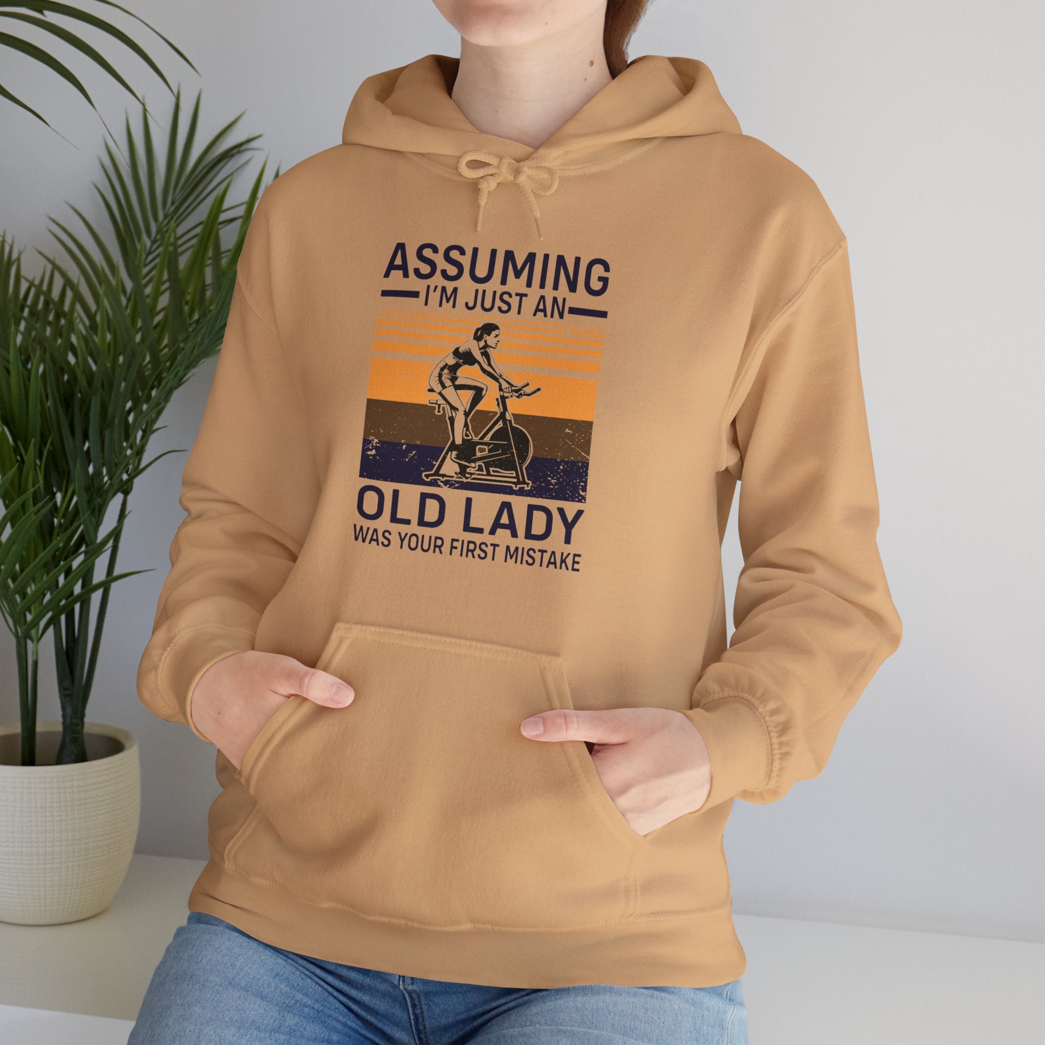 "Assuming I M Just An Old Lady Was Your First Mistake"  Unisex Heavy Blend™ Hooded Sweatshirt