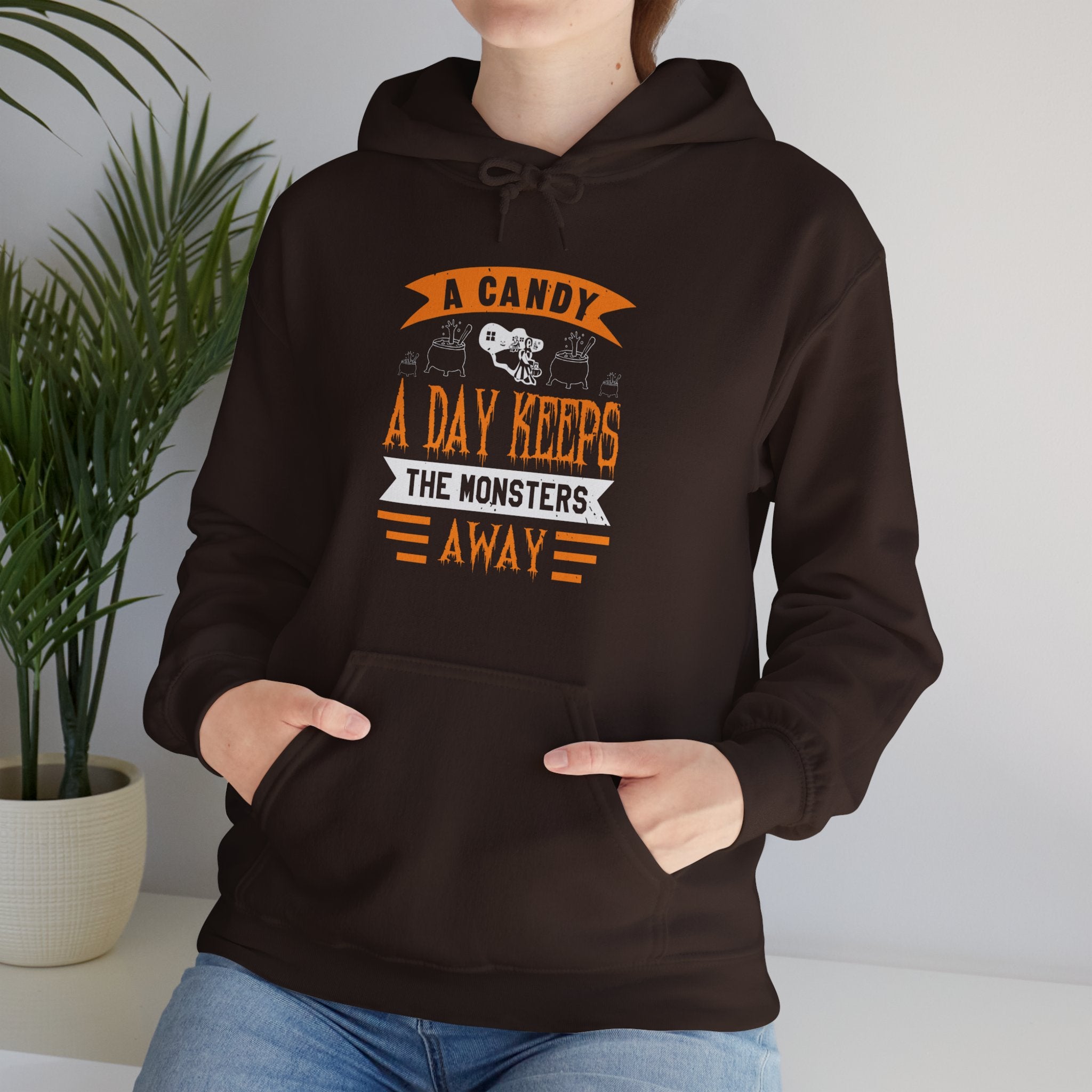 "A CANDY A DAY KEEPS THE MONSTERS AWAY" Unisex Heavy Blend™ Hooded Sweatshirt