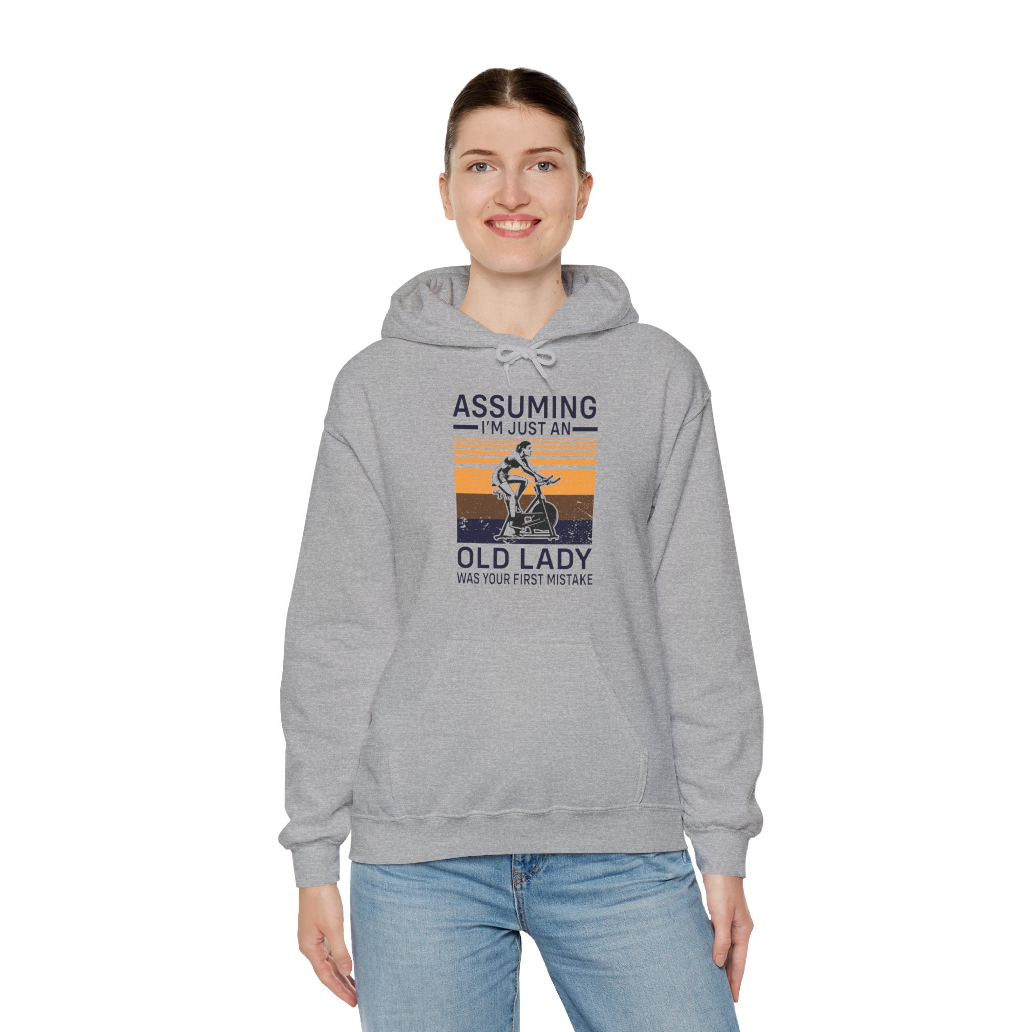 "Assuming I M Just An Old Lady Was Your First Mistake"  Unisex Heavy Blend™ Hooded Sweatshirt