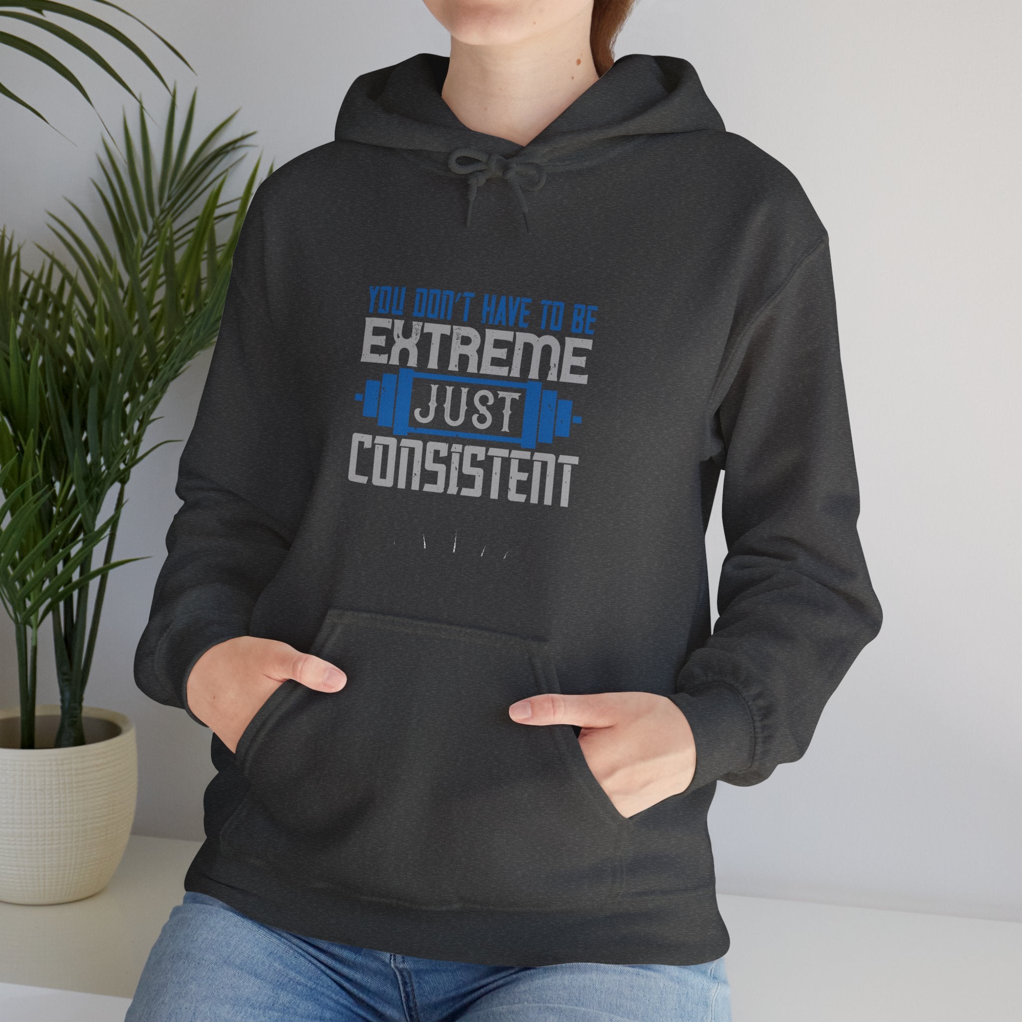 "You don’t have to be extreme, just consistent" Unisex Heavy Blend™ Hooded Sweatshirt