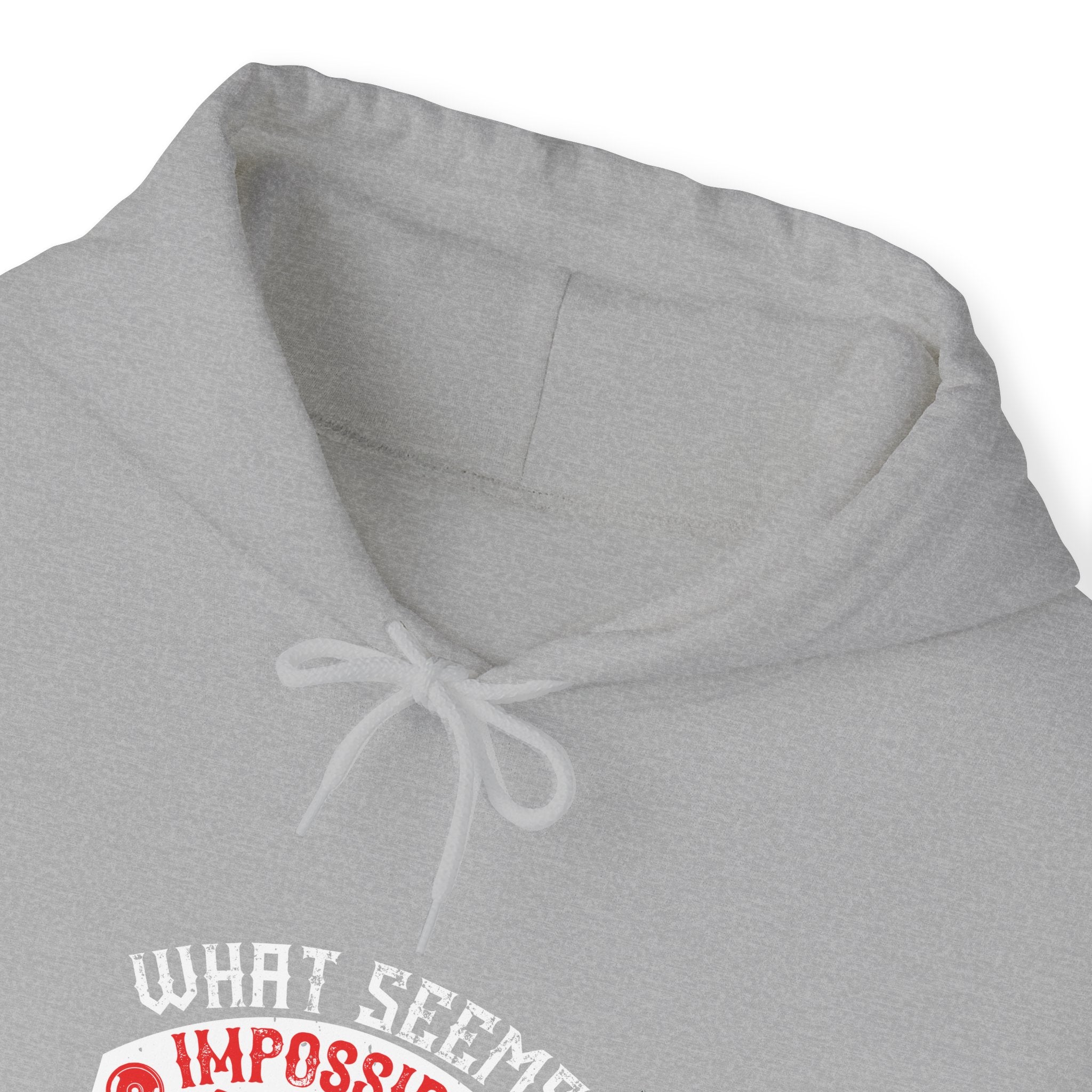 "What seems impossible today will one day become your warm-up" Unisex Heavy Blend™ Hooded Sweatshirt