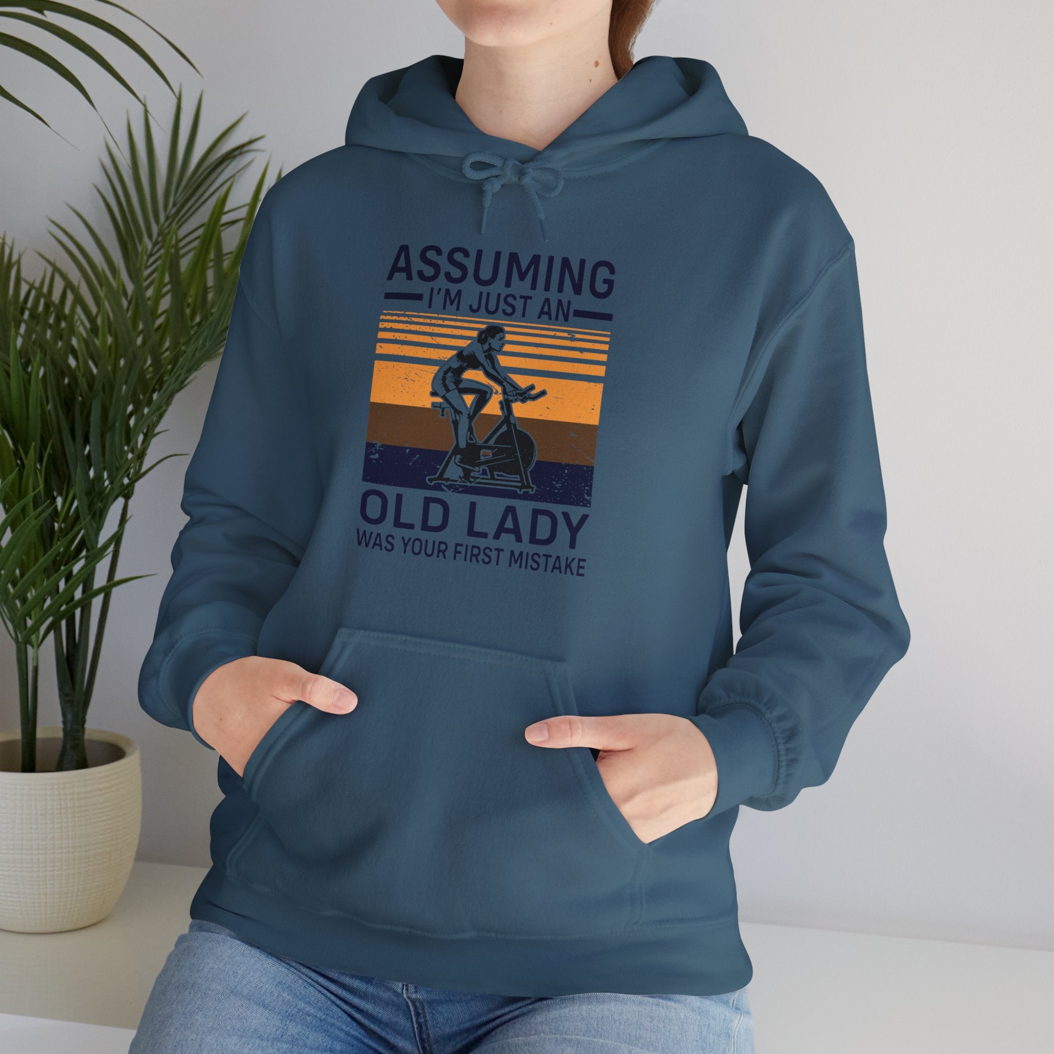 "Assuming I M Just An Old Lady Was Your First Mistake"  Unisex Heavy Blend™ Hooded Sweatshirt