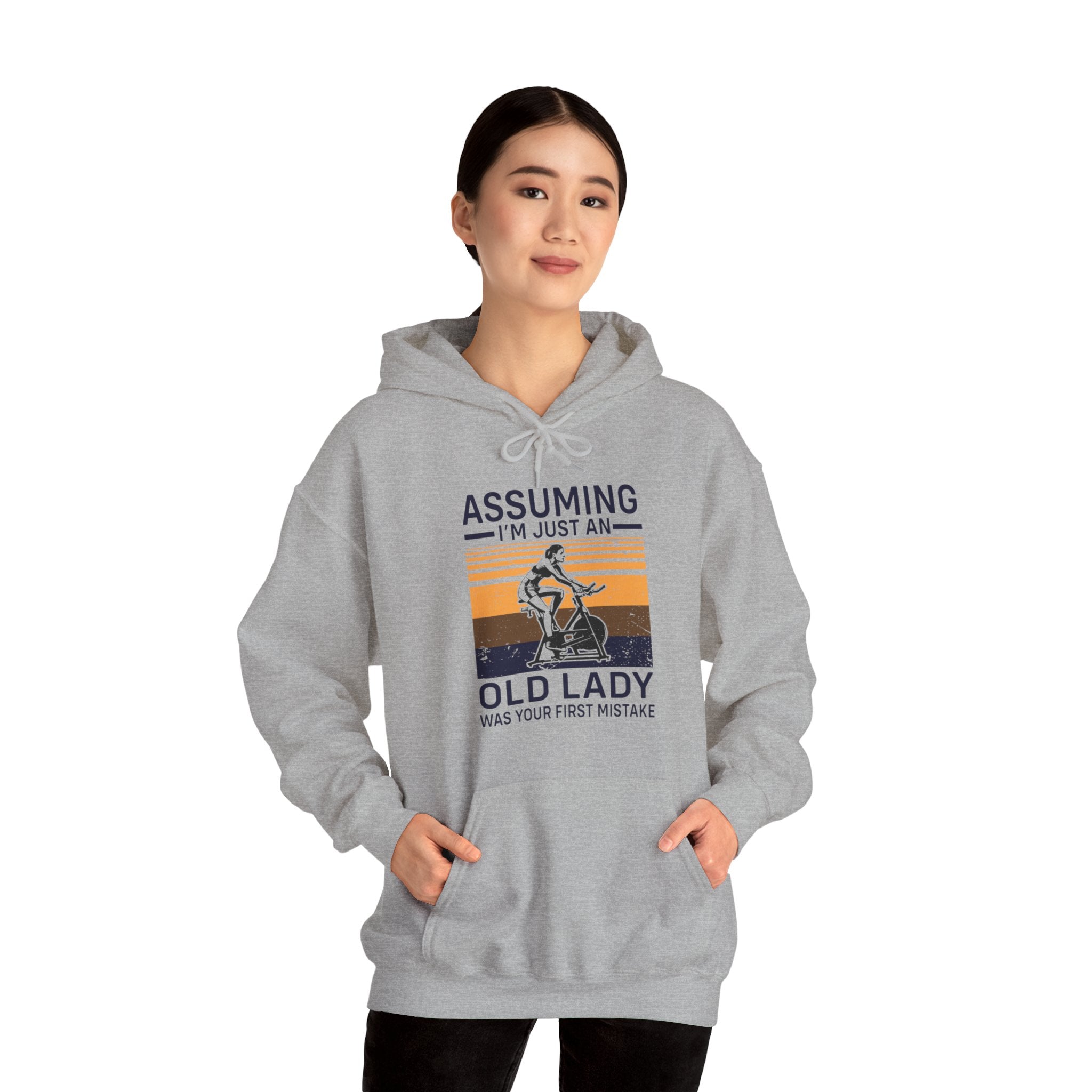 "Assuming I M Just An Old Lady Was Your First Mistake"  Unisex Heavy Blend™ Hooded Sweatshirt