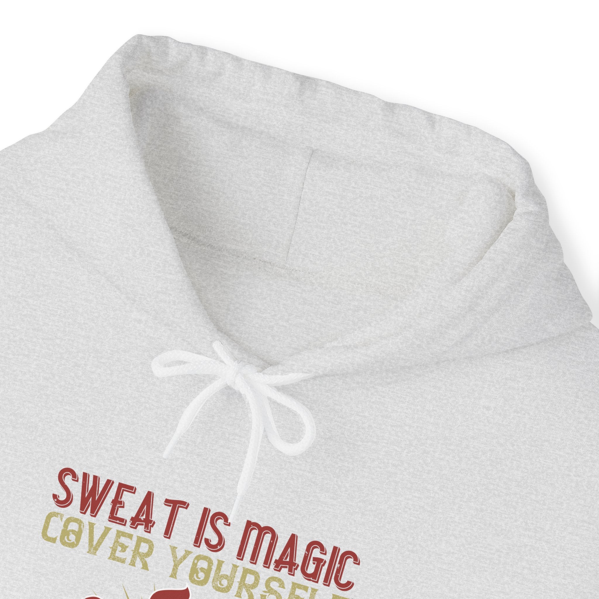 "Sweat is magic Cover yourself in it daily to grant your wishes"  Unisex Heavy Blend™ Hooded Sweatshirt