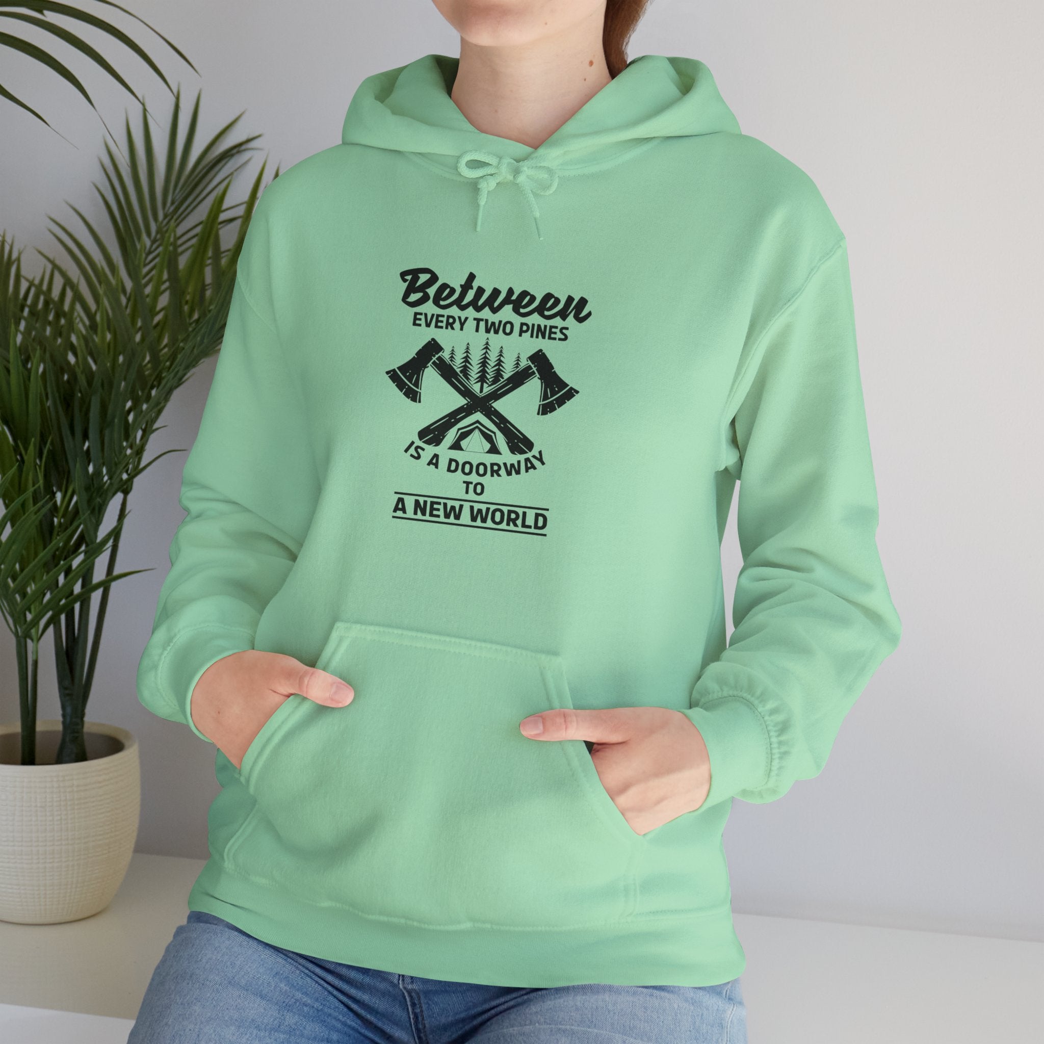 "Between Every Two Pines Is A Door To New World" Unisex Heavy Blend™ Hooded Sweatshirt