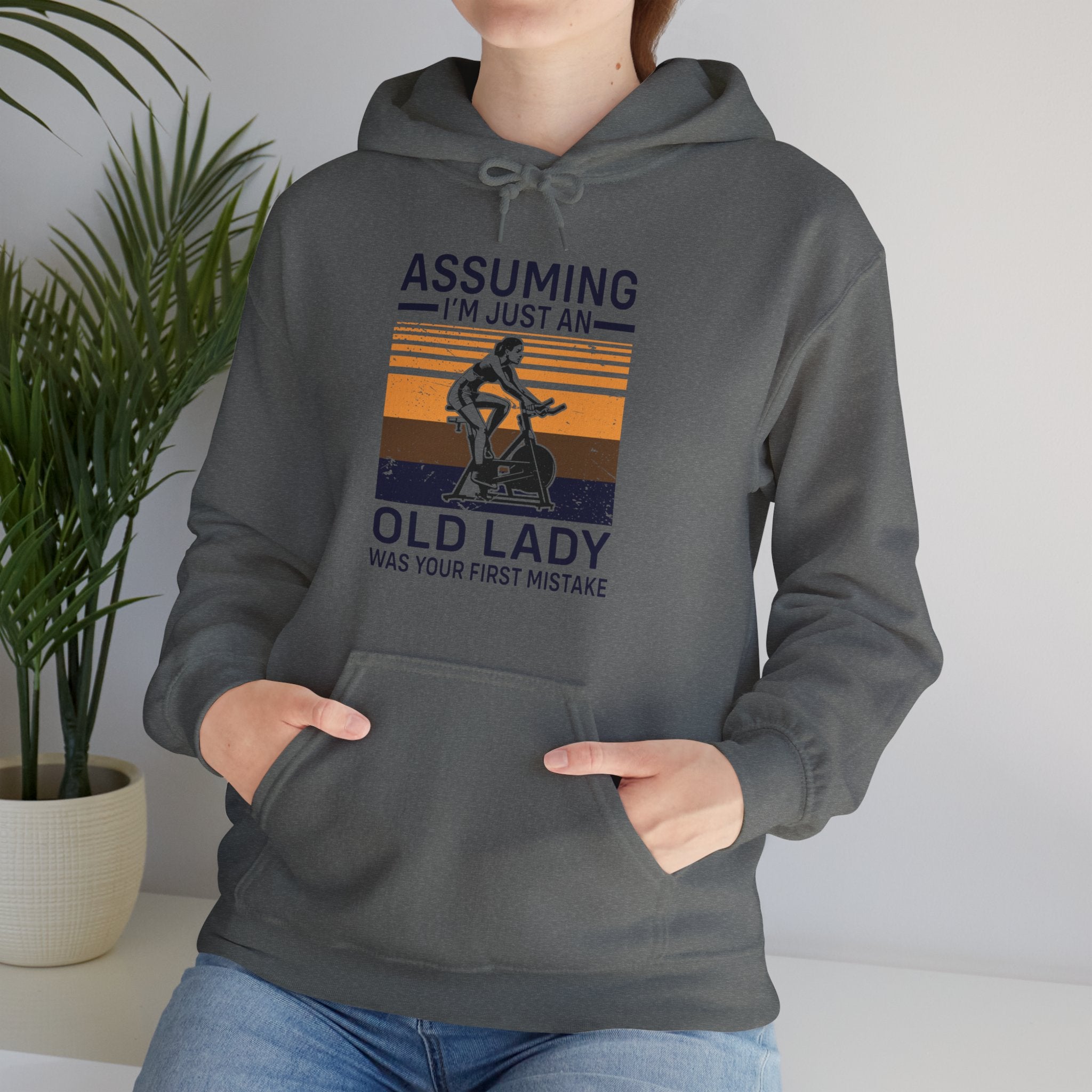 "Assuming I M Just An Old Lady Was Your First Mistake"  Unisex Heavy Blend™ Hooded Sweatshirt