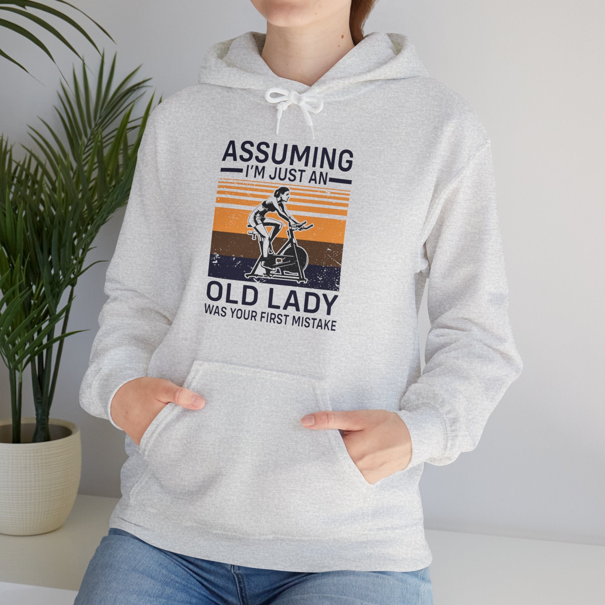 "Assuming I M Just An Old Lady Was Your First Mistake"  Unisex Heavy Blend™ Hooded Sweatshirt