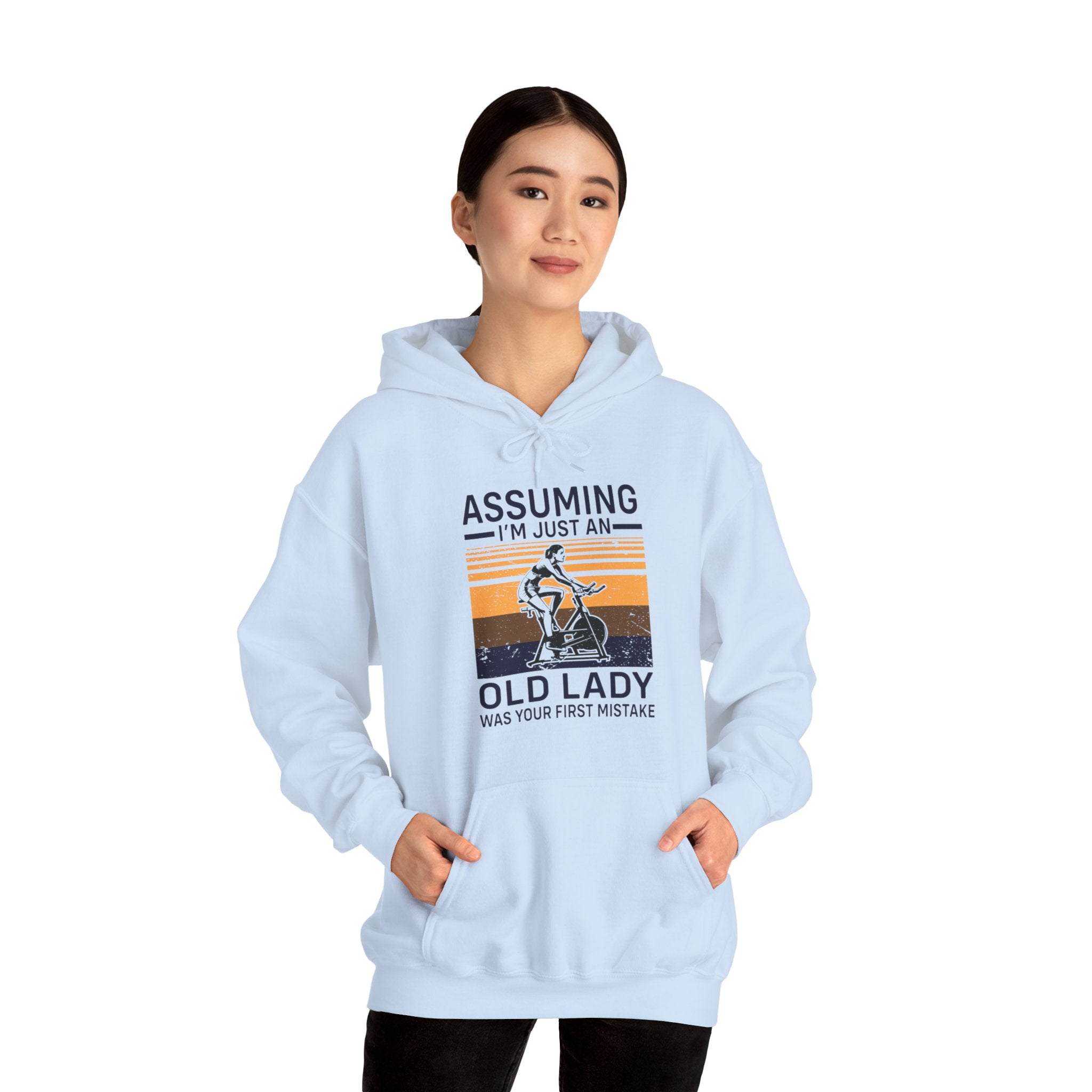 "Assuming I M Just An Old Lady Was Your First Mistake"  Unisex Heavy Blend™ Hooded Sweatshirt