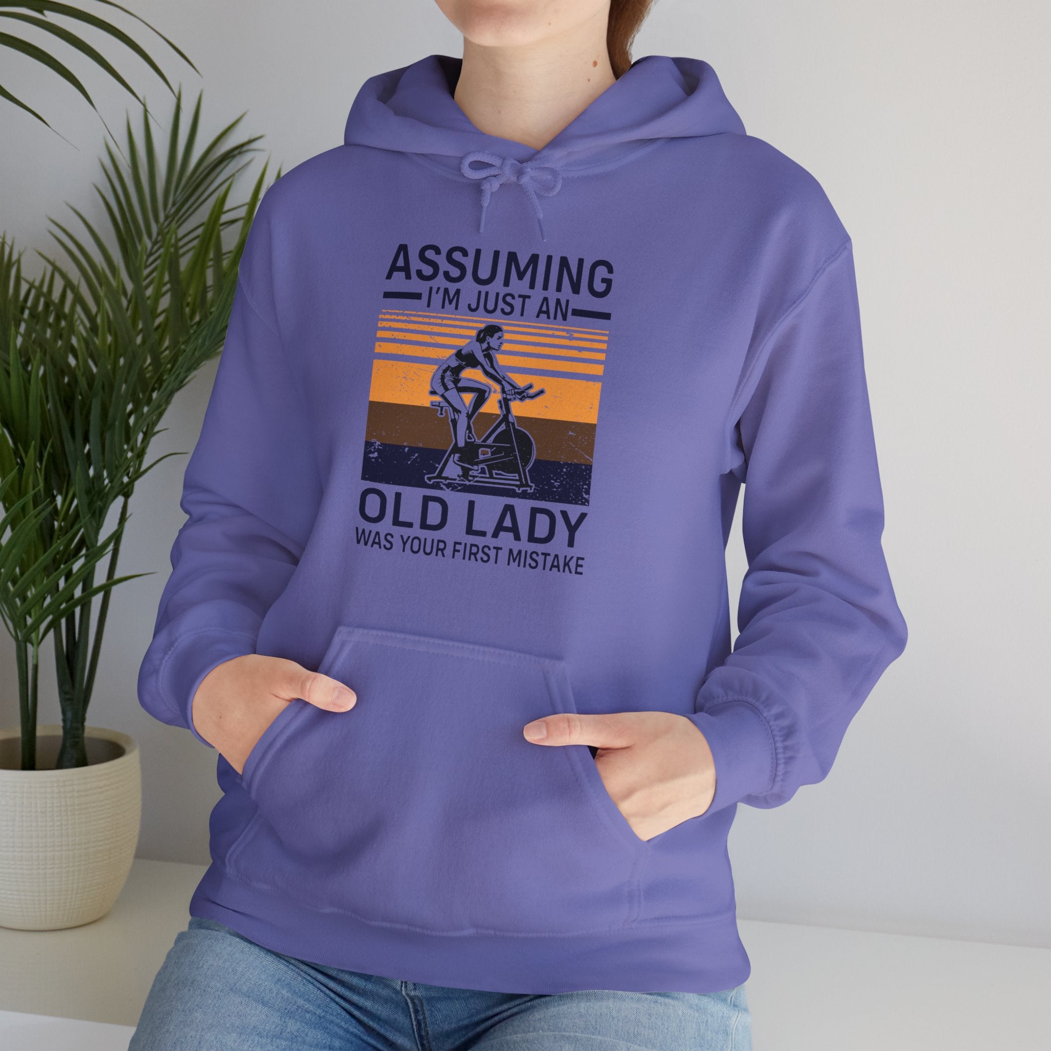 "Assuming I M Just An Old Lady Was Your First Mistake"  Unisex Heavy Blend™ Hooded Sweatshirt