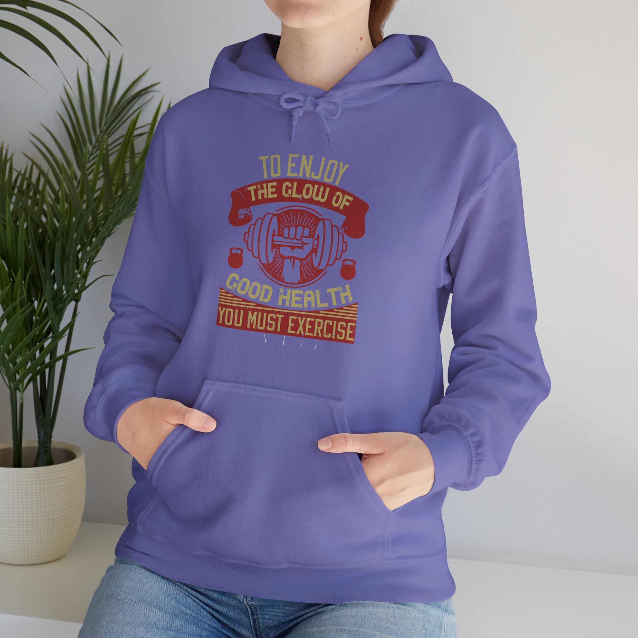 "To enjoy the glow of good health, you must exercise"  Unisex Heavy Blend™ Hooded Sweatshirt