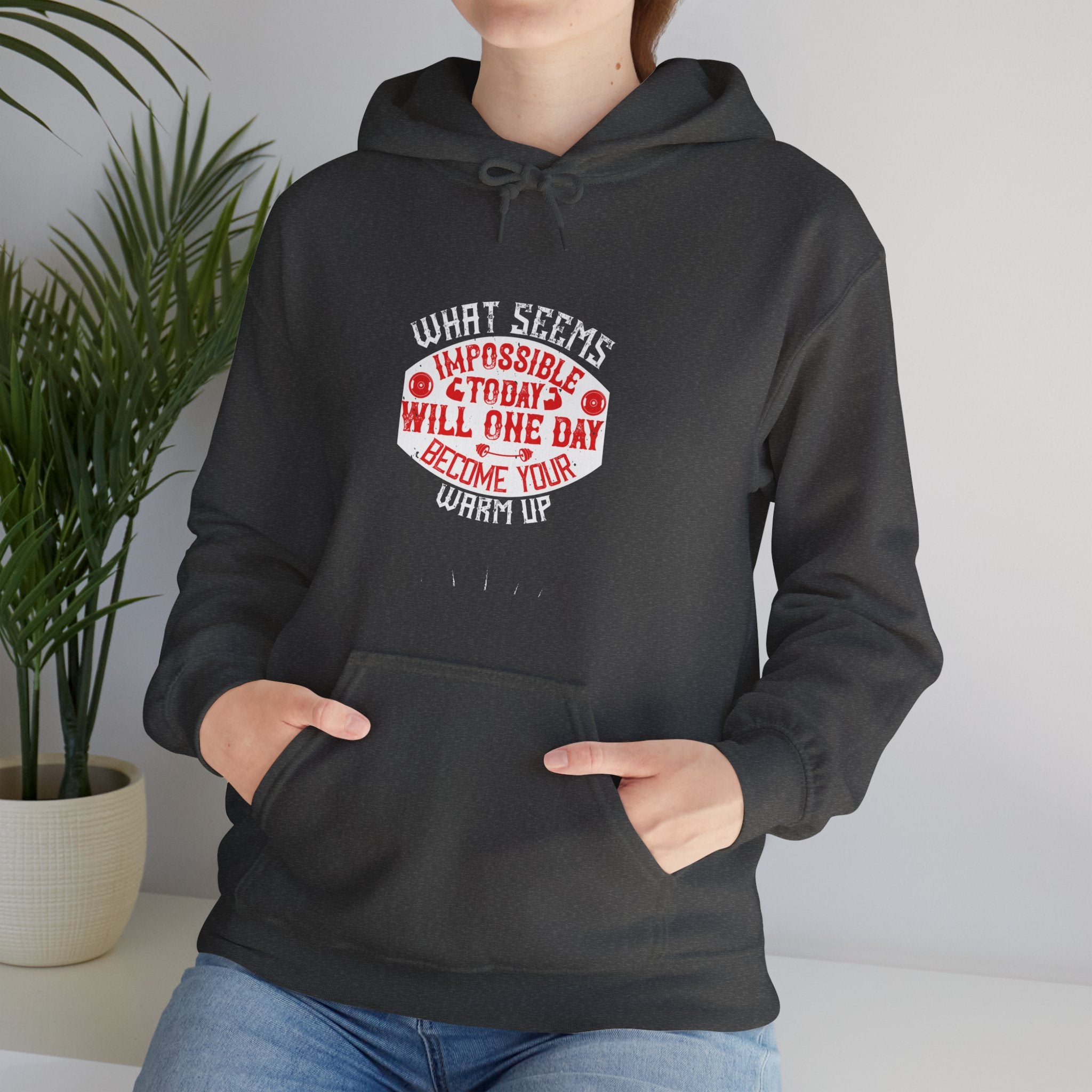 "What seems impossible today will one day become your warm-up" Unisex Heavy Blend™ Hooded Sweatshirt