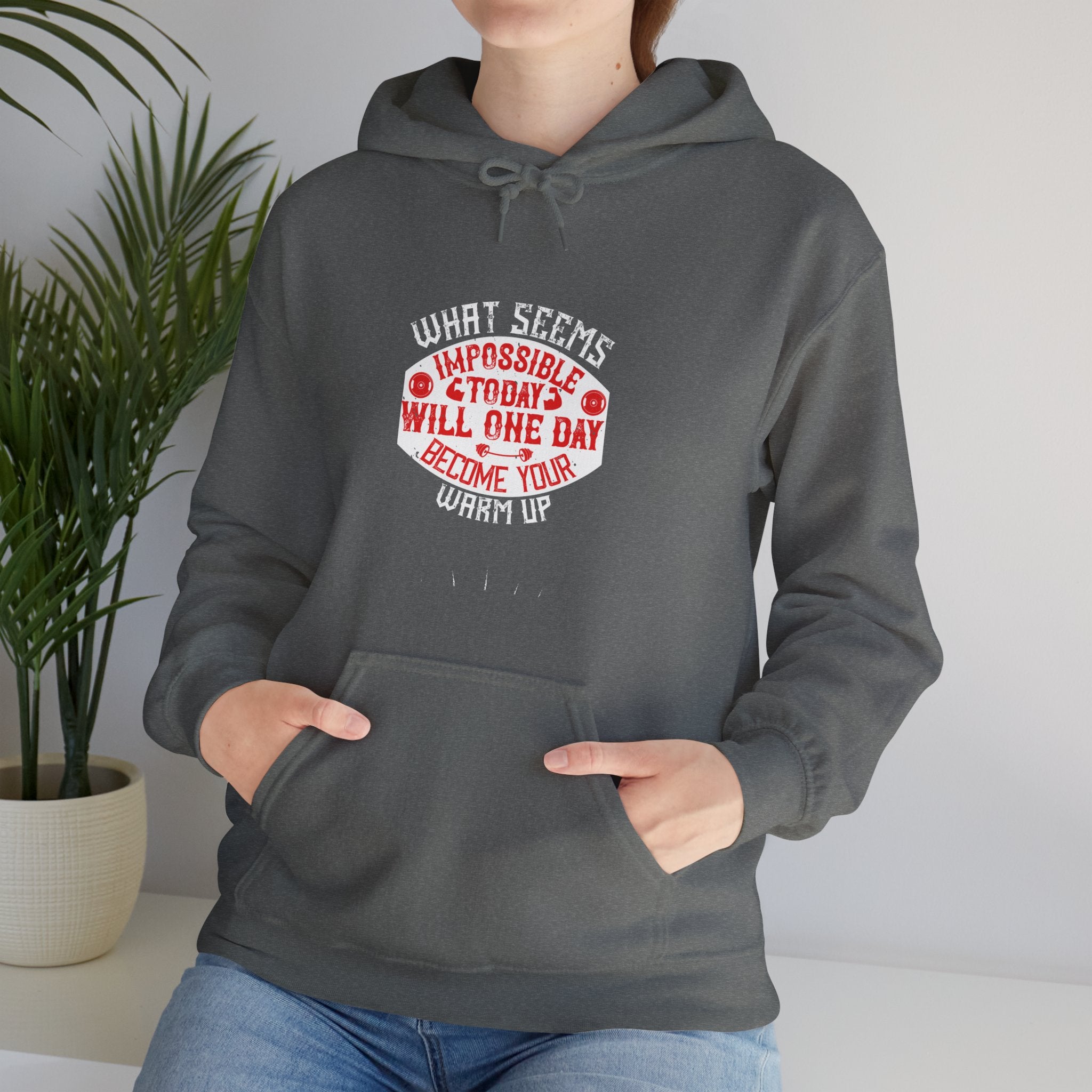 "What seems impossible today will one day become your warm-up" Unisex Heavy Blend™ Hooded Sweatshirt